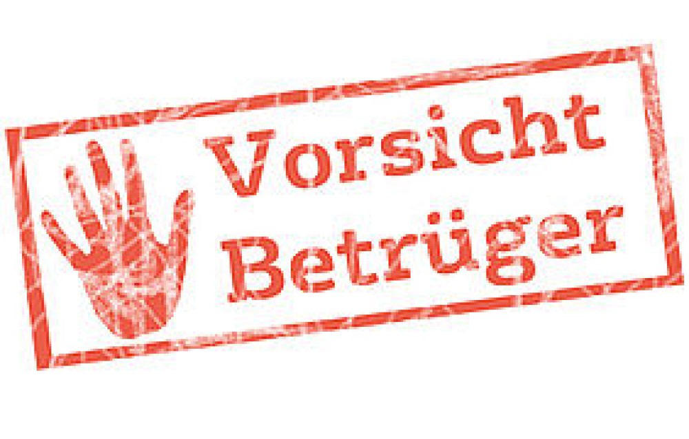 Grafik mit roter Aufschrift "Vorsicht Betrüger"